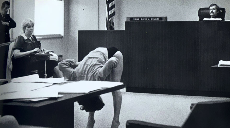 girl bends over in courtroom