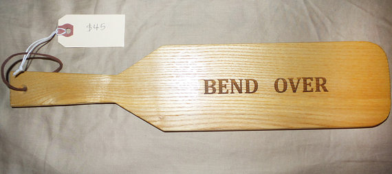 paddle with bend over lettered on it