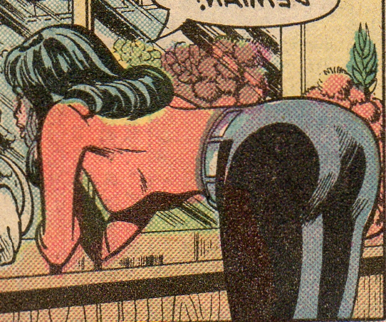 black canary bends over, elbows on the table