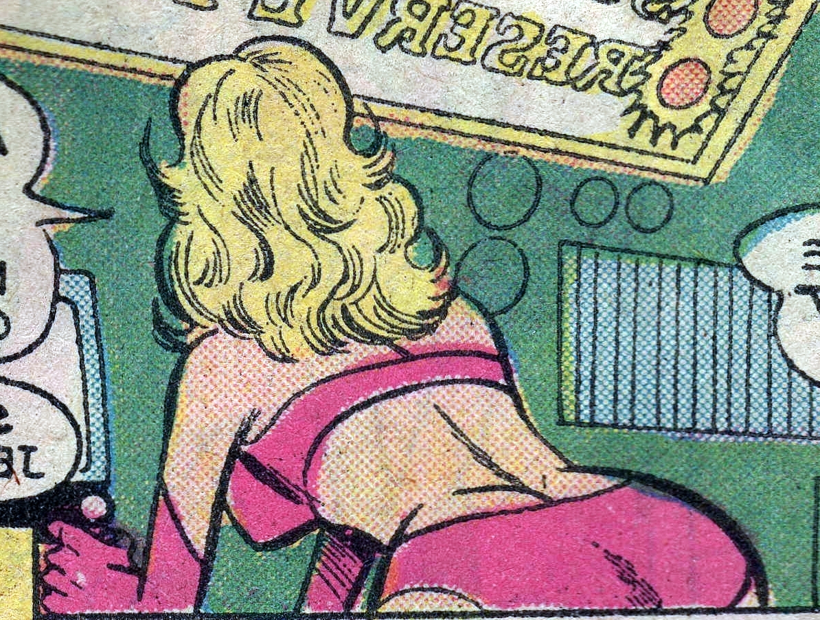 saturn girl bends over a console