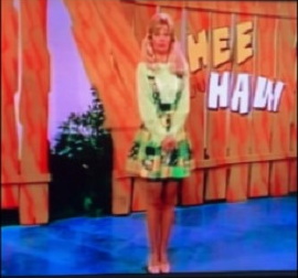 gunilla hutton blows the punch line and gets a paddle-swat on hee-haw